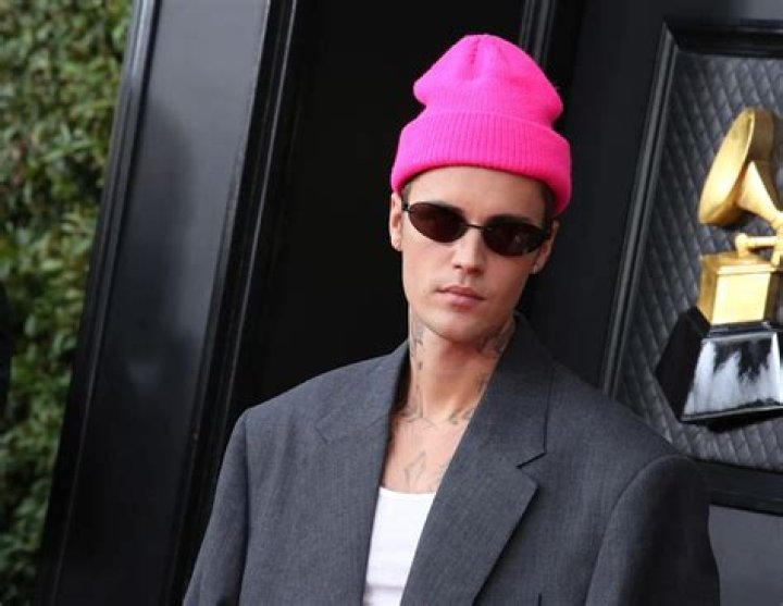 Justin Bieber Spotted Wearing a Blanket at Vanity Fair Oscars Party After Skipping Red Carpet With Hailey